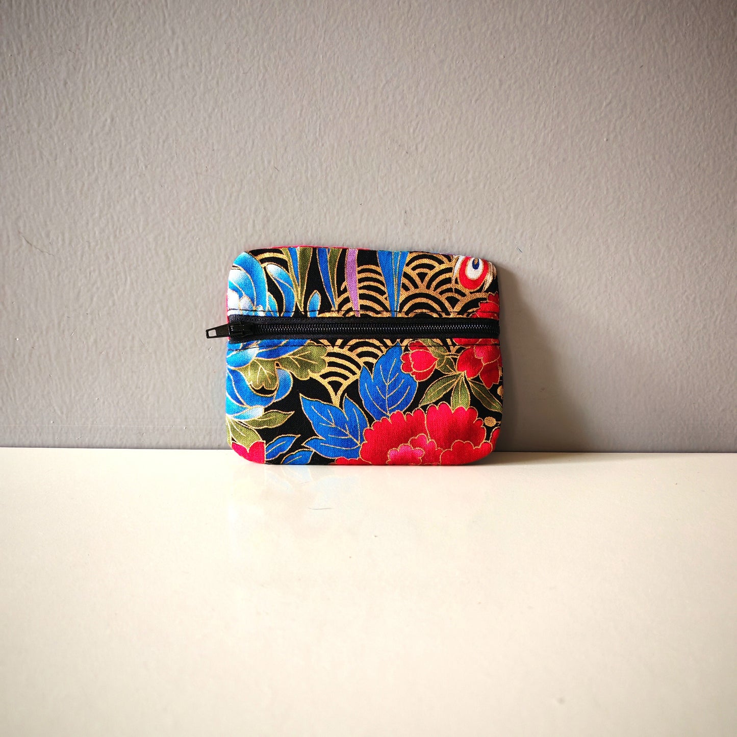 Les porte-monnaies zip avant
